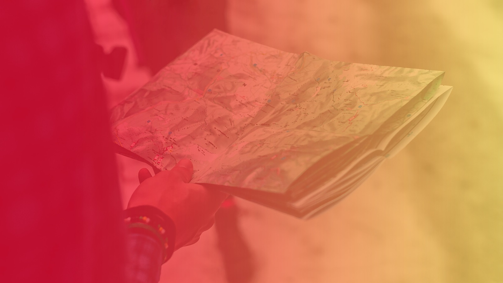 Large header graphic with boy holding map, red to gold gradient overlay